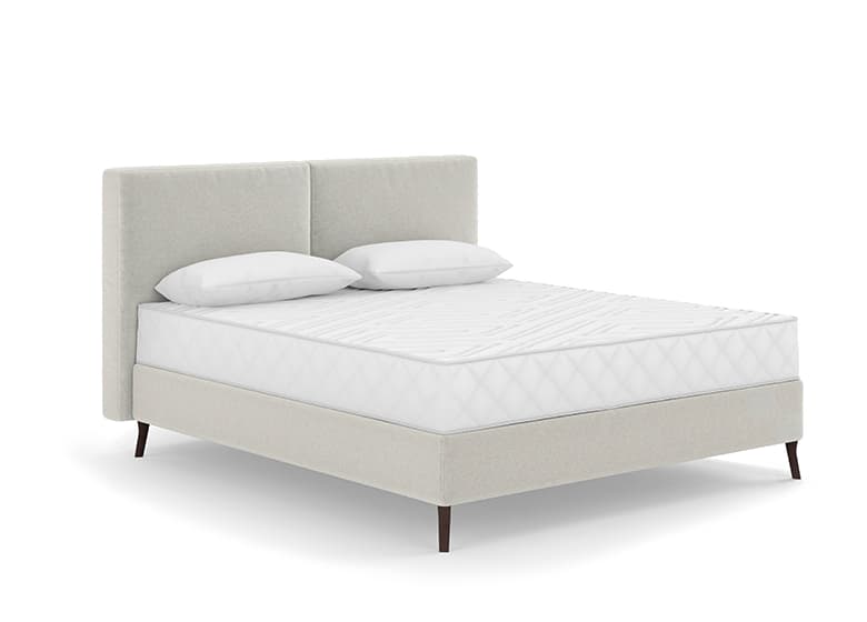 Freisteller eines bodenfreien Boxspringbetts in weiß