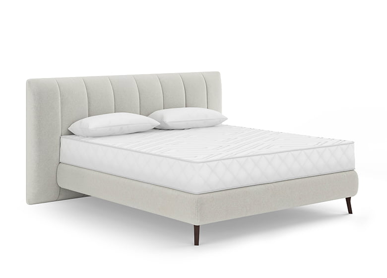 Freisteller eines bodenfreien Boxspringbetts in weiß